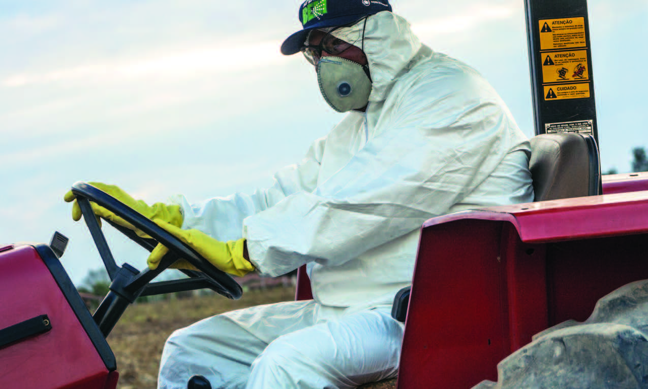 A worker spraying pesticide 