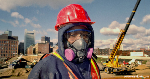A construction worker wearing protective equipment