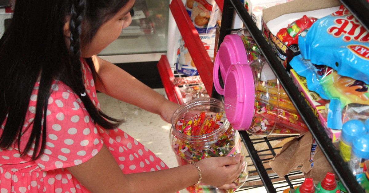 girl buying candy
