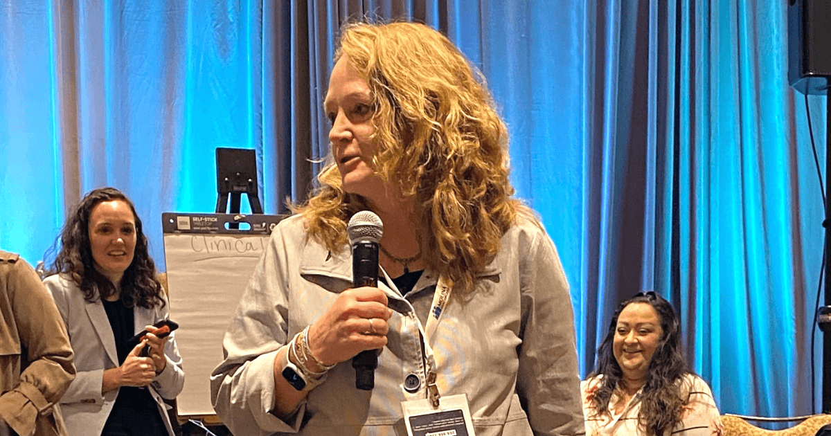 Jillian speaks at a conference