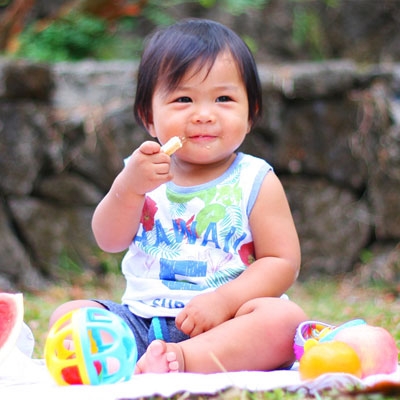 child eating food at picnic