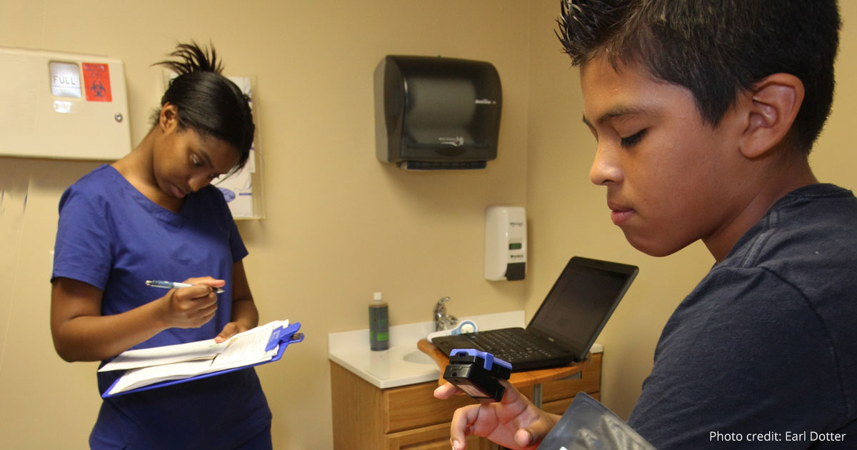 Child in clinic with clinician