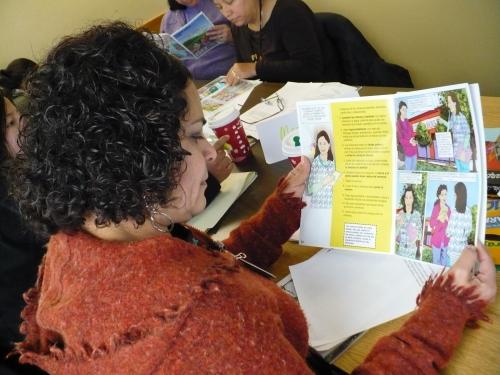 PHOTO: Mother reading lead education comic book