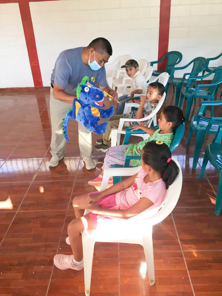 Teacher works with students in Honduras