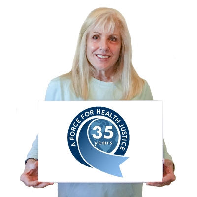 MCN's CEO Karen Mountain holding a 35 year anniversary sign